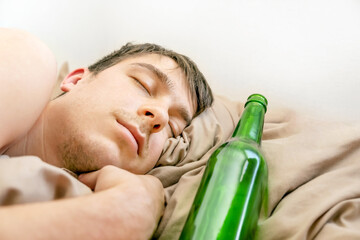 Wall Mural - Young Man sleep with a Beer