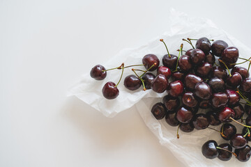 Wall Mural - Close up of pile of ripe cherries with stalks. Fresh red cherries. Ripe cherries background.