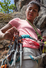 Fit Rock Climber Preparing To Climb