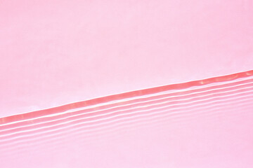 Wall Mural - Transparent pink water surface texture with horizontal waves and ripples