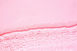 Background, texture of transparent pink water with seething ripples , waves