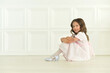 © aletia2011 - Portrait of cute girl posing on the floor in studio