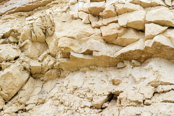 Ruins in a quarry. Dumps of clay and crushed stone in a quarry.