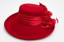 Studio Photo Of A Red Vintage Hat. The Background Is White.