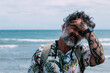 © jcalvera - Portrait of a modern middle aged man in casual shirt on the beach