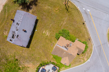 Wall Mural - Roofing construction site the removal of gray asphalt roof damaged an aerial view