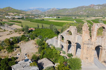 Canvas Print - Roman aqueduct at Aspendos. Tower for turning water. Ruin. Turkey. Aerial photography. View from above