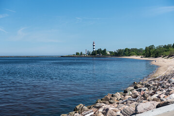 Wall Mural - Daugavgriva lighthouse on a sunny summer day, Latvia.