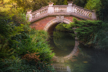 Wall Mural - Bridge above pond with reflection in Parc Monceau, Paris, France