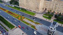 Aerial View On Triumphal Arch, Victory Park In Moscow. Along Triumphal Arch On Kutuzov Avenue Moving Cars And Pedestrians