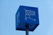 Blue metal box on a metal pole that has a drawing of a shopping cart on it.