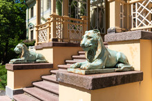Naukseni Manor With Two Lions In Sunny Summer Day, Latvia.