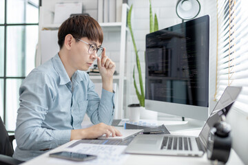 Professional development programmers are sit on a desk with work equipment such as: computer-laptop-tablet. for working in programming or writing code on  website,  HTML, javascript, Software.