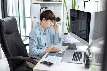 Professional development programmers are sit on a desk with work equipment such as: computer-laptop-tablet. for working in programming or writing code on  website,  HTML, javascript, Software.