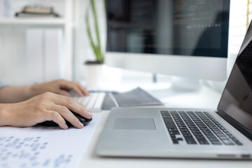 professional development programmers are sit on a desk with work equipment such as: computer-laptop-