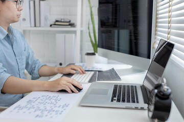 Professional development programmers are sit on a desk with work equipment such as: computer-laptop-tablet. for working in programming or writing code on  website,  HTML, javascript, Software.