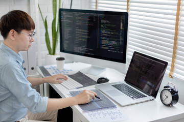 professional development programmers are laying out a structure or draft on paper in preparation for