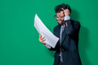 © IHERPHOTO - Confused businessman with documents in hand, Businessman puzzled with documents in hand isolated, Concept of man in formal suit frustrated with documents in hand