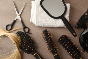 Equipment for hairdressing service on wooden table top view