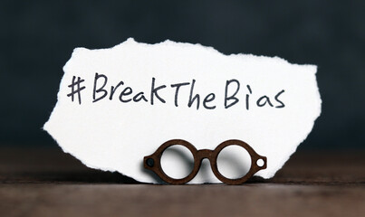 Wall Mural - Torn paper with the word ‘BreakTheBias' written on it. Break the bias campaign.
