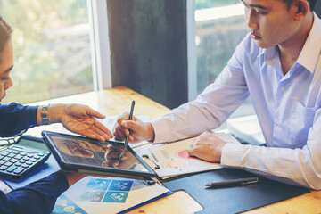 Businessman with digital pencil to puts signature on digital electronic contract in digital tablet. Smart Business investment concept. Selected focus