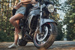 © perfectlab - Close up of the legs of a young couple embracing on a motorcycle