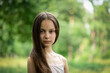 © Olena Shvets - Portrait of beautiful preteen girl in forest on summer sunny day