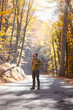 © Seleznov_Molchanova - Young handsome man posing in autumn forest. young hipster guy with backpack , traveller standing in woods, Hiking, Forest, Journey, active healthy lifestyle, adventure, vacation concept.