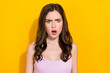 © deagreez - Portrait of astonished person open mouth stare speechless camera isolated on yellow color background