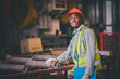 © Suriyo - Portrait African American Black afro worker in factory, Cameroon Black man employee work in  production plant manufacture factory industry and operator line machine steel metal using helmet for safety