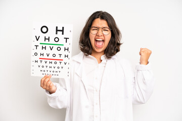 Wall Mural - hispanic pretty girl covering mouth with hands with a shocked. optical vision test concept