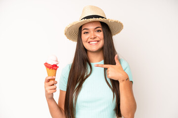 hispanic pretty woma shouting aggressively with an angry expression. ice cream and summer concept