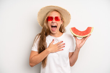 pretty caucasian woman laughing out loud at some hilarious joke. summer and watermelon concept