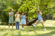 © BGStock72 - Group of asian and caucasian kids having fun in the park