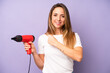 pretty caucasian woman feeling happy and facing a challenge or celebrating. hair dryer concept