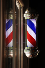 Barber Shop Vintage Pole. Copyspace Barbershop. Barber Shop Pole In Red White And Blue With Lightbulb On Top.