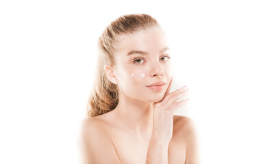 Wall Mural - Posing and putting some cream on her face in studio on white background. Skin care. Spa