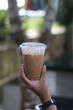 © syuraiah - Closeup of Iced Caramel Macchiato at the coffee shop, Caramel Macchiato is a classic macchiato beverage. It consists of vanilla syrup, espresso, steamed milk, foam, and caramel drizzle