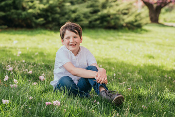 little child sitting on the grass