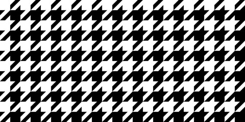 Seamless simple vintage houndstooth checker pattern. Tileable black and white gingham hound tooth background texture. Trendy classic geometric fashion motif for clothing, bedding and textiles..