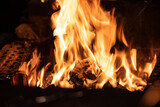 Fototapeta Miasto - Long exposure image of a campfire burning at night.
