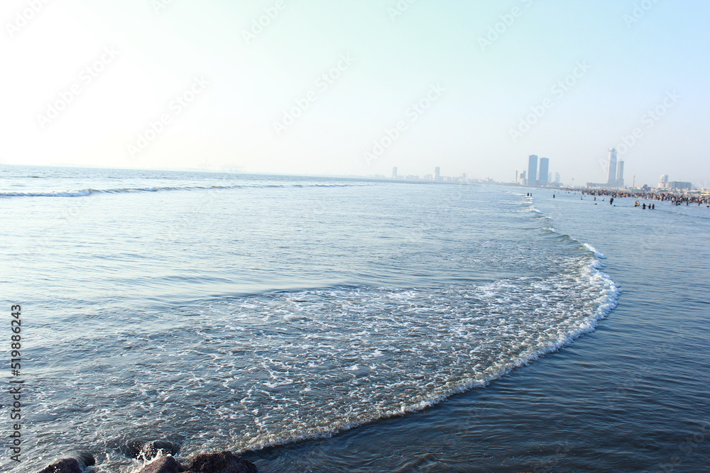 A beautiful picture of seaview wave with buildings karachi sindh ...
