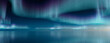 © RocknRoller Studios - Aurora Borealis reflected in Water. Green Northern Lights Background with copy-space.