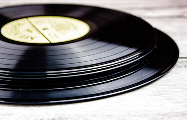 Stack of original vinyl records close-up. Music vinyl records LP with blur.