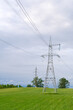 © nadyadudaeva - Power lines in a green field. sunny day
