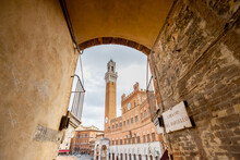 Bell Tower Of A Town Hall Of Siena City In Italy. Traveling Old Towns Of Tuscany Region