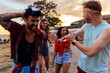 © bernardbodo - Group of friends dancing on the way to festival