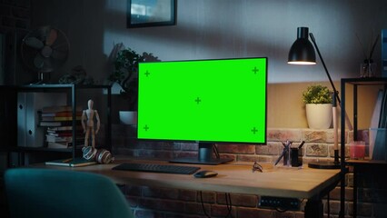 Fototapete - Computer Monitor with Green Screen Standing on a Wooden Desk with Height Adjustable Function. Chroma Key Display at Home in Modern Living Room or Creative Loft Office with Brick Wall. Zoom In Shot.