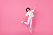 Leinwandbild Motiv Full size photo of cheerful pretty person jumping have good mood isolated on pink color background
