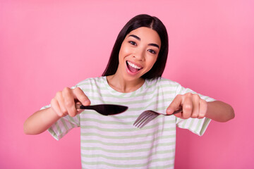 Photo of funky excited lady starving enjoy taste supper in cafe use kitchen silver tools isolated pastel color background